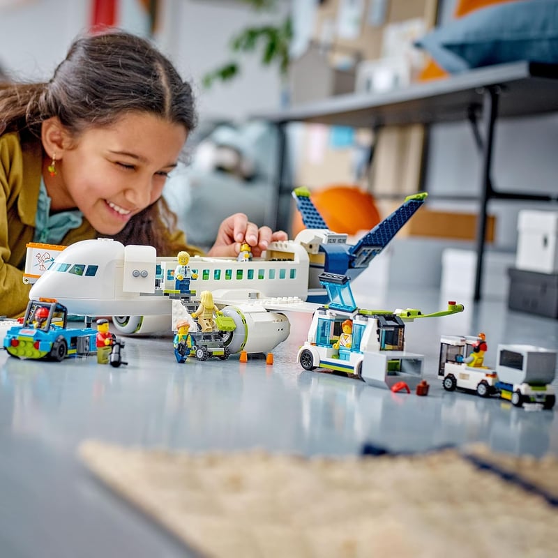 LEGO City Passenger Airplane Toy Set with 9 Minifigures, Ages 7+